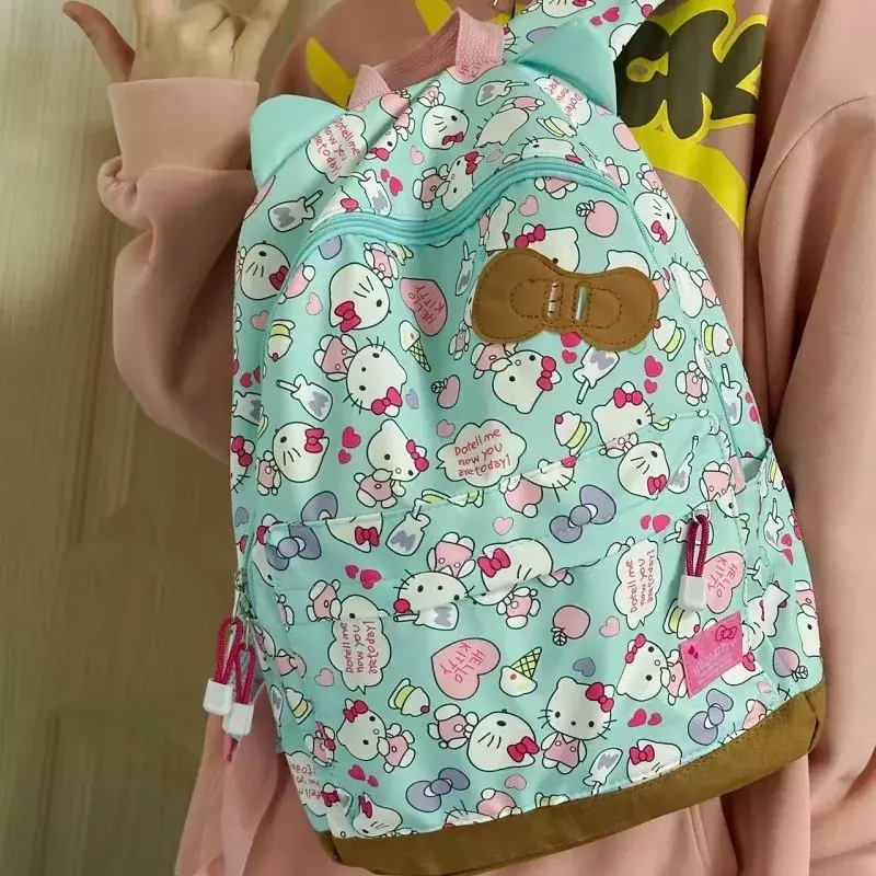 Sanrio กระเป๋านักเรียนลายเฮลโลคิตตี้, ใหม่กระเป๋าสะพายไหล่ลำลองและน้ำหนักเบากระเป๋าเป้สะพายหลังความจุขนาดใหญ่ลายการ์ตูนน่ารัก