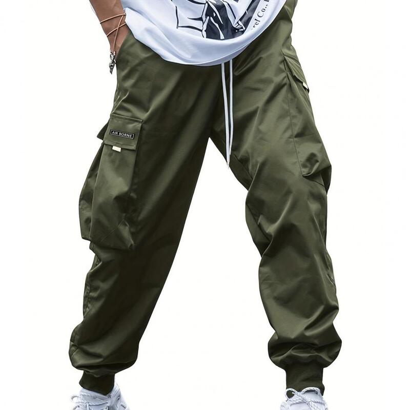 Брюки-карго мужские с множеством карманов, стильные удобные повседневные штаны с эластичным поясом и застежкой на шнурке