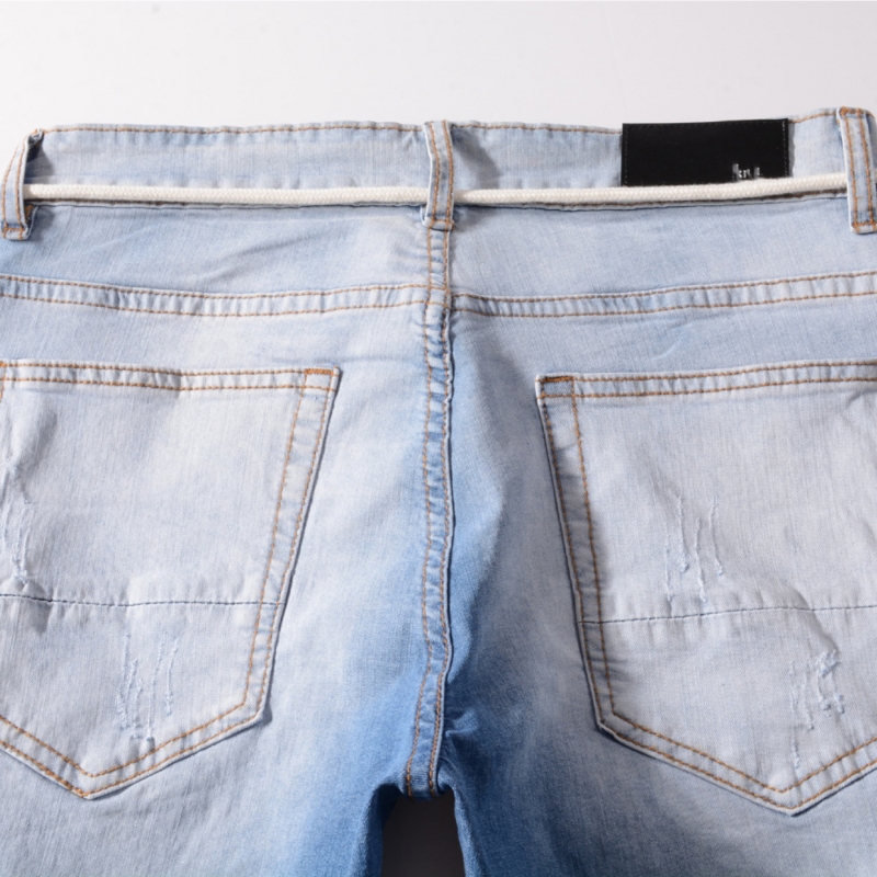 Wiosenne letnie męskie jeansy w stylu Vintage niebieski jednolity kolor elastyczne smukłe męskie spodnie dżinsowe motocyklowe spodnie ołówkowe