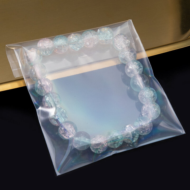 50 szt. Przeźroczystych Laser holograficzny torba samoprzylepna woreczków w kolorze Aurora na biżuterię do prezent odznaka torby do przechowywania opakowań