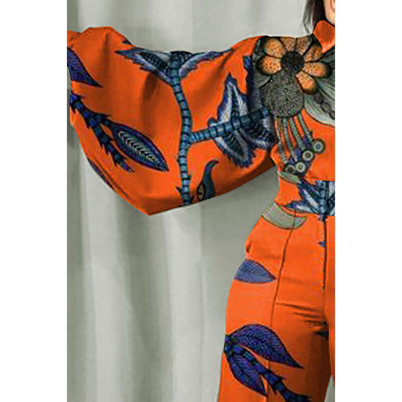 Женский оранжевый комбинезон с широкими штанинами и принтом
