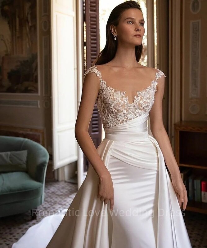 Wspaniała suknia ślubna syrenka długość podłogi rękawy Cap elegancka koronka aplikacja satynowe plisy sukienki panny młodej Vestidos De Novia