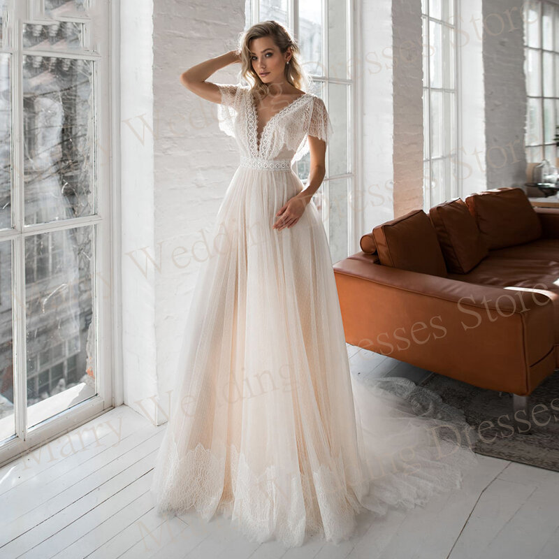 Fascynujące nowoczesne damskie suknie ślubne z linii klasyczne koronki aplikacje suknie panny młodej Sexy V dekolt bez pleców tiulowa szata De Mariée