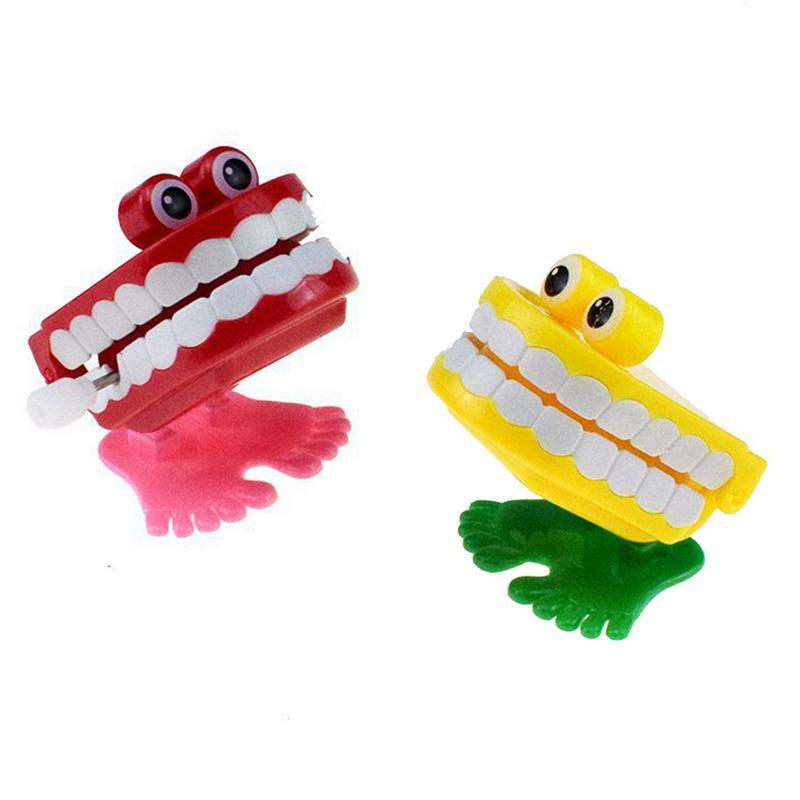 Novità dentiere giocattolo a orologeria denti divertenti orologio che batte sulla catena giocattolo per saltare divertente giocattolo a carica regalo di Halloween per bambini