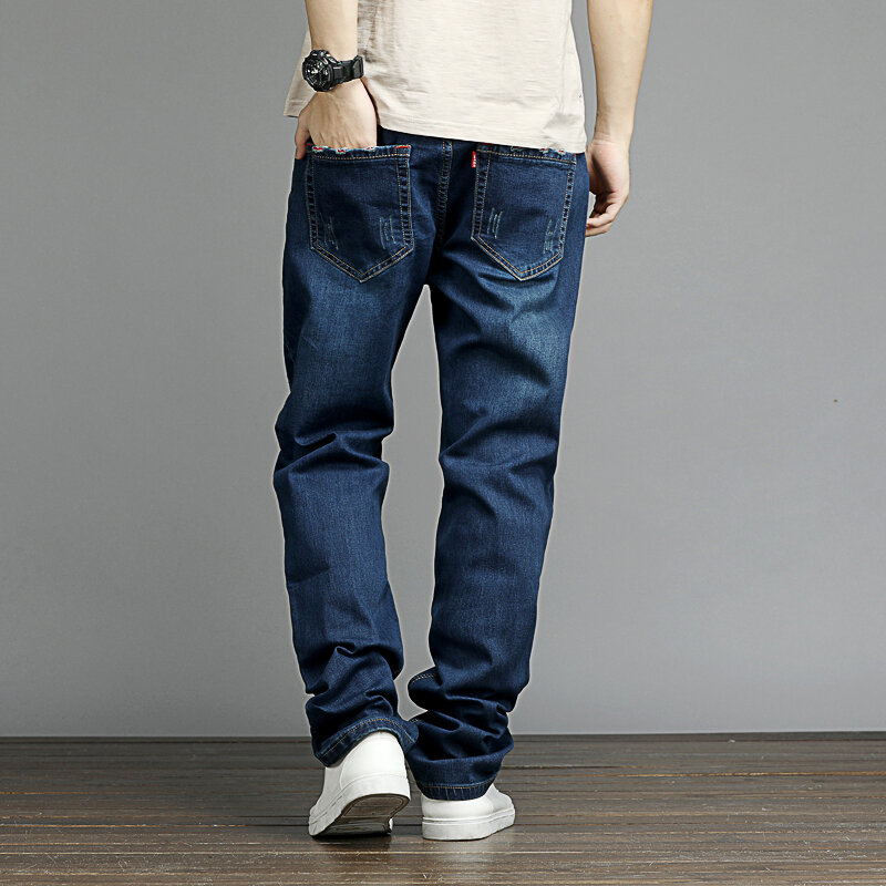 Celana Jeans elastis pria, celana Denim elastis lurus ukuran besar 48 gaya sederhana hitam biru regang ukuran besar celana pensil 2024