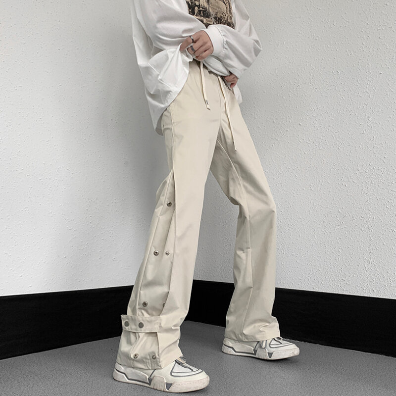 Bojówki męskie modne młodzieńcze popularne letnie z guzikami wzorem w jednolitym kolorze Streetwear w amerykańskim stylu luźne spodnie szyk