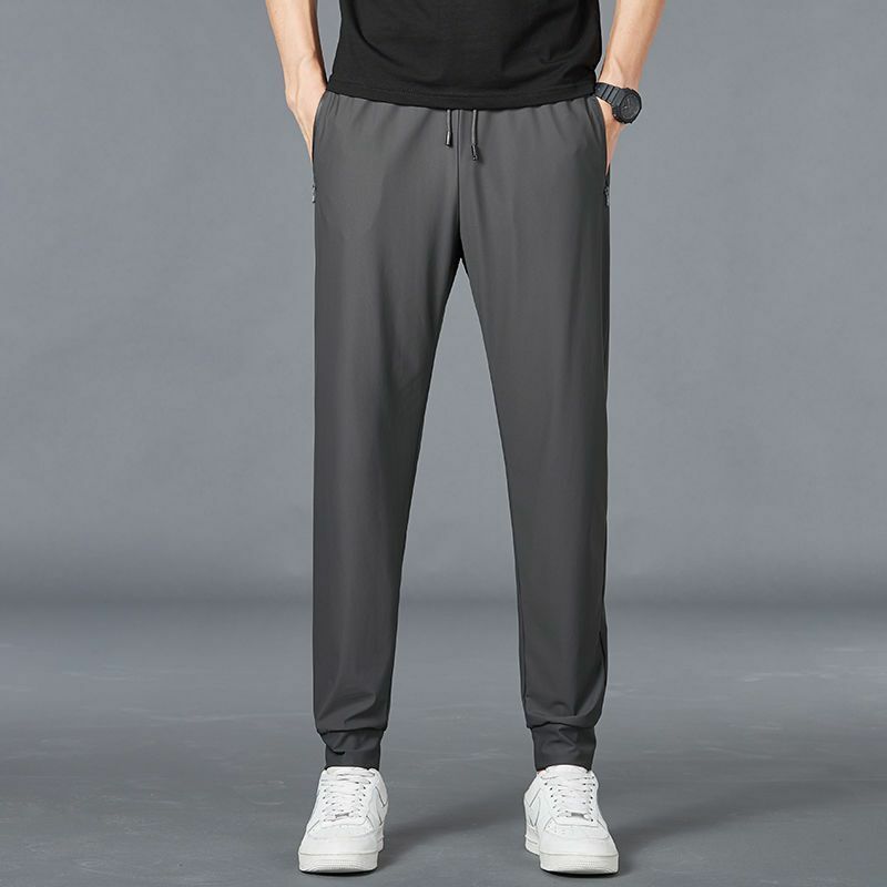 Letnie oddychające siateczkowe czarne spodnie dresowe męskie odzież sportowa luźne spodnie męskie casualowe spodnie dresowe Plus rozmiar 5XL 6XL