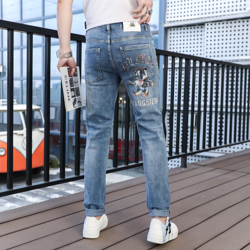 Markowe jeansy męskie z nowym nadrukiem w stylu Hip-hopowym uliczny Punk dżinsy z nadrukiem Slim Fit spodnie dżinsowe spodnie typu Casual