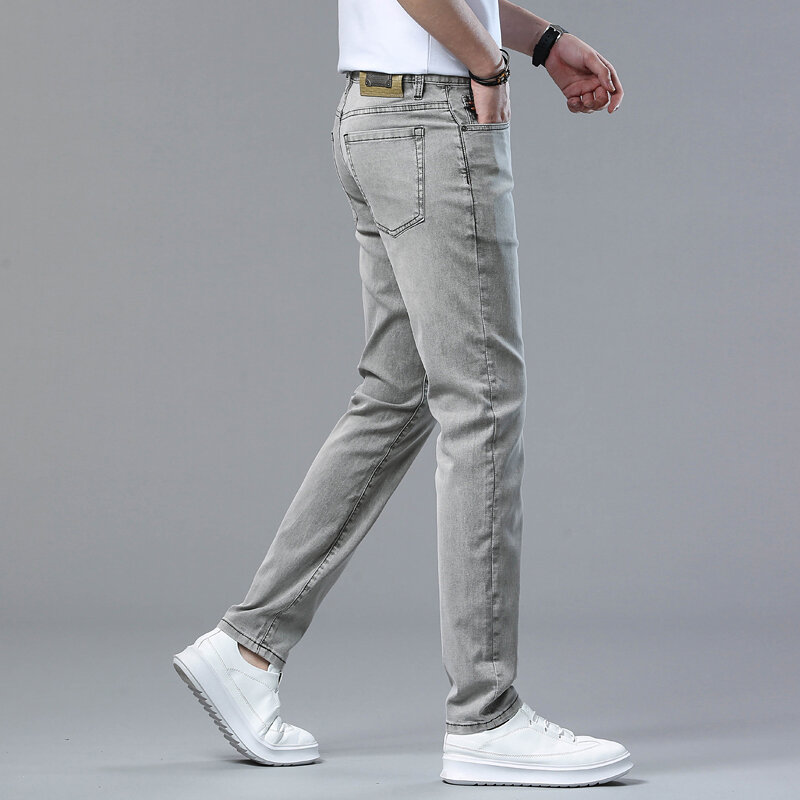 Celana jeans bisnis pria, tipis elastis slim fit kecil kaki lurus celana kasual serbaguna Musim Panas 2024