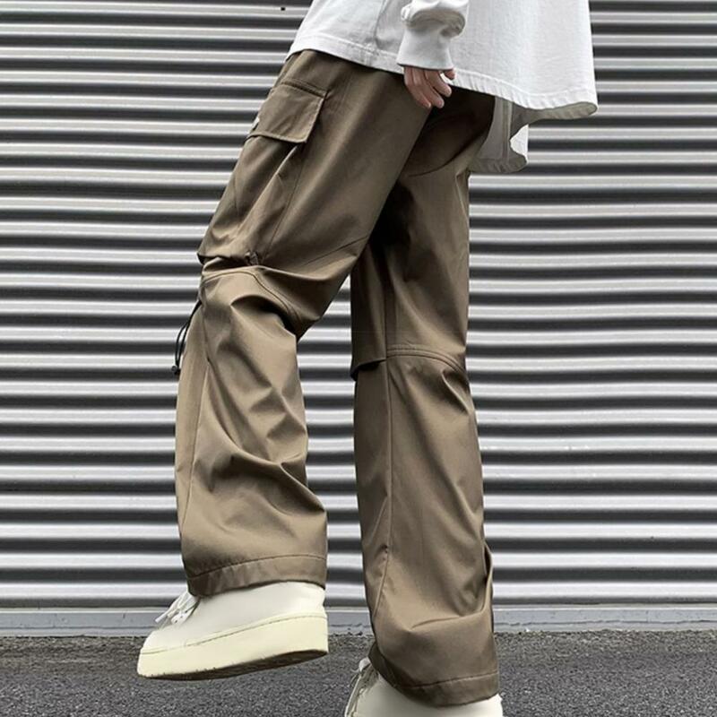 Męskie spodnie ściągany sznurkiem w pasie w stylu ulicznym męskie spodnie Cargo z szeroką nogawką wiele kieszeni elastyczną talią jednolity kolor do noszenia