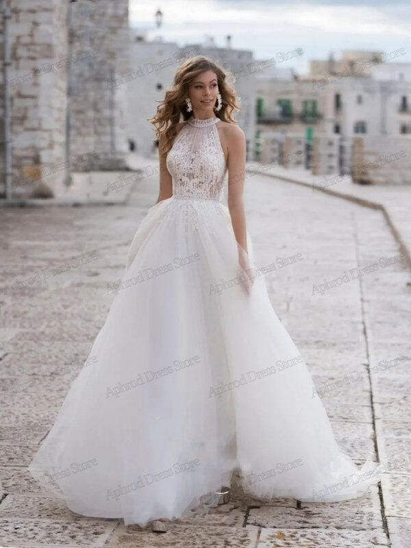 Klasyczne suknie ślubne z tiulowej linii tiulowej suknie ślubne koronkowe aplikacje z dekoltem bez rękawów na imprezę Vestidos De Novia