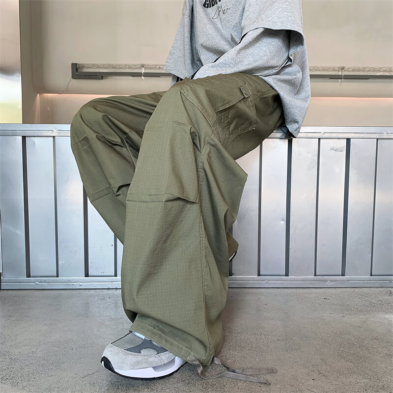 Streetwear 2023 wiosna na co dzień spodnie męskie elastyczne w pasie spodnie Cargo w jednolitym kolorze kilka kieszeni luźna, workowata spodnie męskie H82