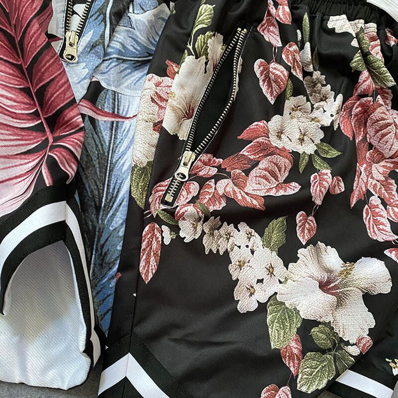 ชุดใส่เล่นแนวสตรีทสำหรับผู้ชายชุดวิ่งแขนสั้นสไตล์ฮิปฮอปทรงหลวมพิมพ์ลายดอกไม้ใส่ไปชายหาดสไตล์ฮาวาย