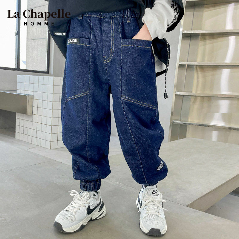 Spodnie chłopięce wiosna i jesienne dżinsy 2022 jesienno-zimowe jednowarstwowe spodnie z polarową podszewką aksamitne spodnie