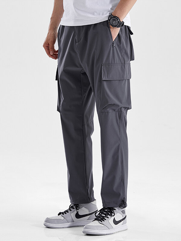 Verão calças de carga masculina de secagem rápida tamanho grande 8xl multi-bolsos solto sweatpants trabalho corredores casuais em linha reta calças compridas masculino