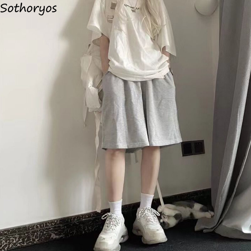 Celana pendek longgar untuk wanita uniseks keren Streetwear Mode Korea Solid wanita santai Sporty kaki lebar Harajuku Ins musim panas umum