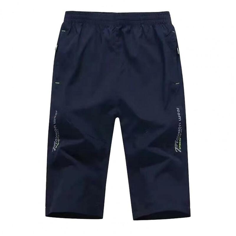 Pantalones cortos transpirables de Color sólido para hombre, longitud media pantorrilla, cintura elástica, bolsillos con cremallera, hielo suave y cómodo