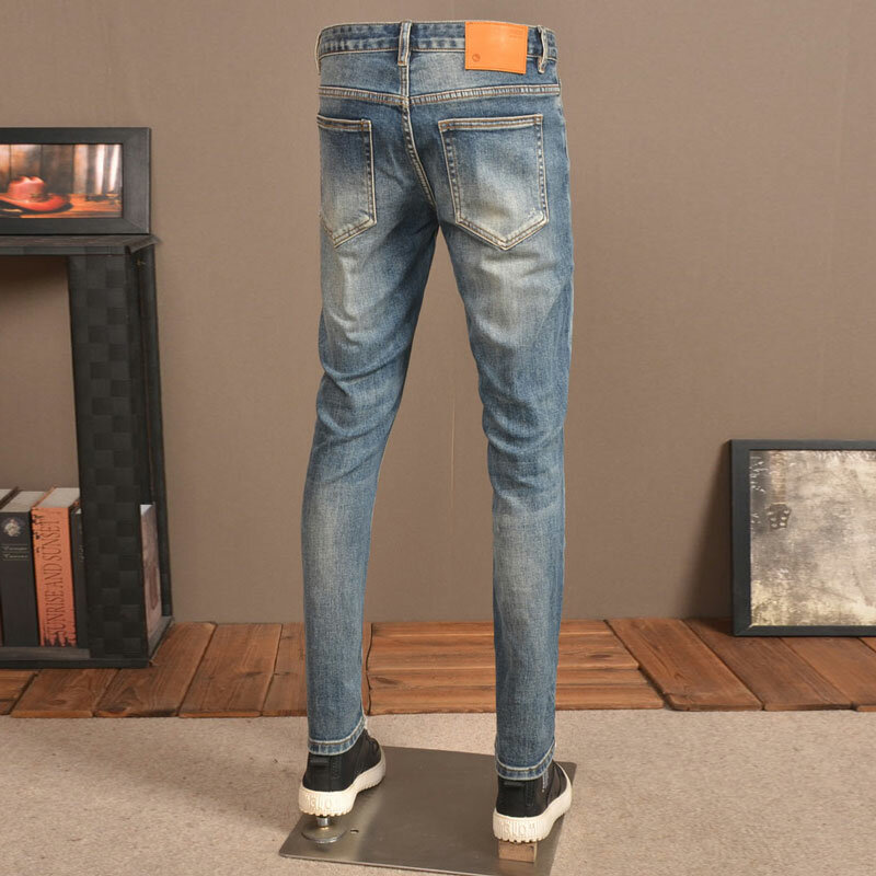 Streetwear modne dżinsy męskie niebieskie w stylu Retro rozciągliwe chudy krój porwane jeansy męskie łatane spodnie Vintage projektant spodnie dżinsowe Hombre