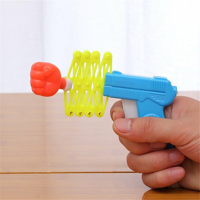 Quente engraçado retrátil punho atirador truque brinquedo engraçado criança crianças festa de plástico festival presente clássico punho telescópico brinquedo