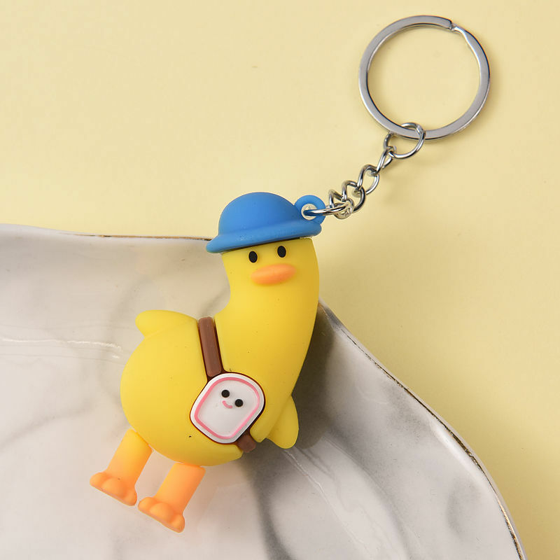 Porte-clés mignon en forme de petit canard jaune en silicone, accessoire de voyage exquis, pendentif cartable, carillon, idéal comme cadeau pour la maternelle