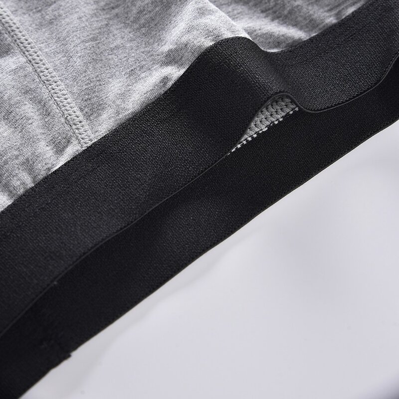 กางเกงในทรงสามเหลี่ยมยืดหยุ่นแฟชั่นผ้าคอตตอนสีพื้นสำหรับผู้ชายกางเกงขาสั้นระบายอากาศได้ดีเซ็กซี่