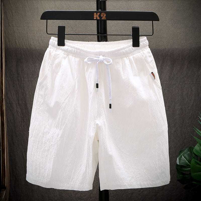 Pantalones cortos de cintura alta para hombre, ropa informal, versátil, holgada, color sólido, primavera y verano