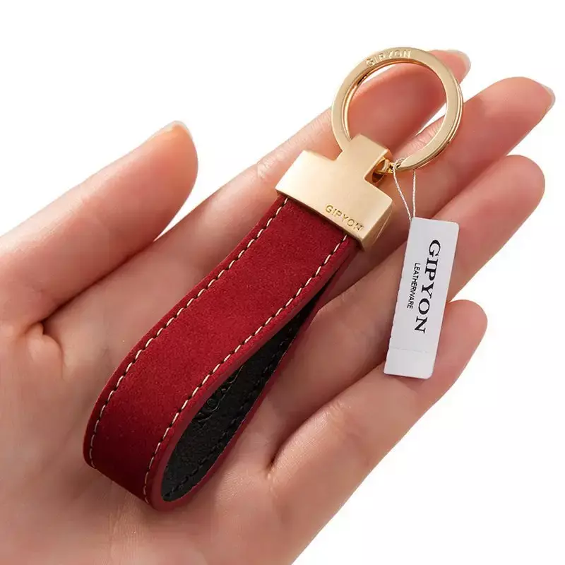 Exquisite high-grade hand rope cowhide simple key chain pendant personalized car chain pendant gift box for men and women.