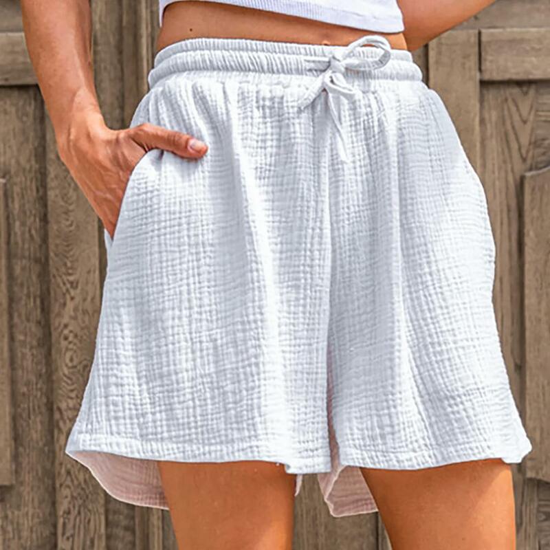 Celana pendek warna polos wanita, bawahan pinggang elastis serut dengan saku longgar untuk musim panas