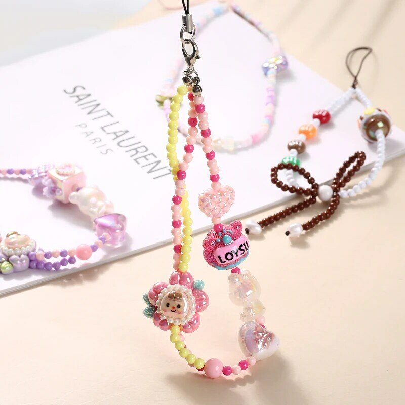 JOLanyard-Téléphone portable perlé anti-perte pour femmes et filles, téléphone portable en acrylique, fleur de dessin animé, nœud en forme de cœur, bijoux à la mode