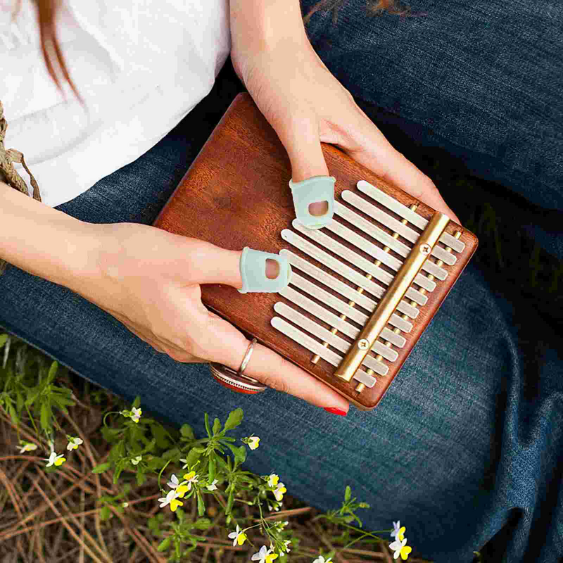 Miękka ochraniacz na palce Kalimba Relief do zabawy w rękawice przeciwbólowe silikonowa osłona na dłonie na Instrument muzyczny Kalimba kciuk fortepian