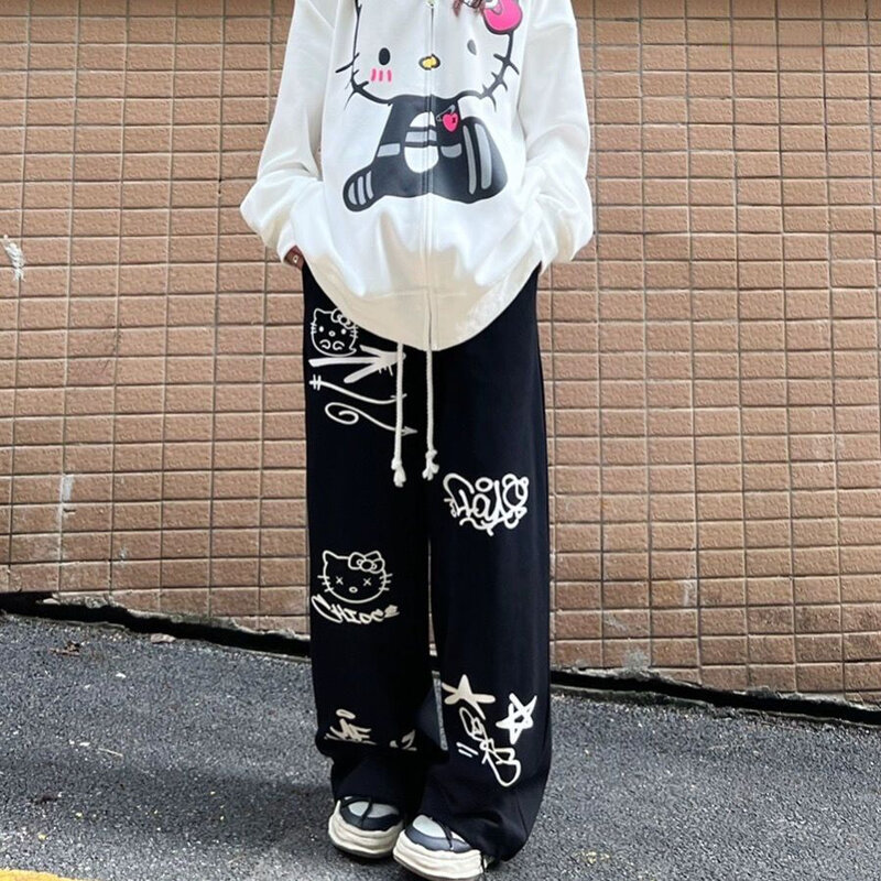 Sanrio Hello Kitty ชุดสตรีทแวร์ผ้าคอตตอน, กางเกงทรงหลวมแนวฮิปฮอปแนวฮิปฮอปแฟชั่นสำหรับผู้หญิงกางเกงขาม้ากราฟฟิตีกางเกงมีเชือกรูดอเนกประสงค์ทำจากผ้าฝ้ายสำหรับ Y2k