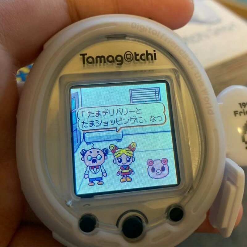 นาฬิกาอิเล็กทรอนิกส์25th อัจฉริยะ Bandai Tamagotchi อัจฉริยะสำหรับสัตว์เลี้ยงอายุจำกัดวันครบรอบปีรูปแบบนาฬิกาสีขาวเคสแบบพกพาสำหรับเด็กวันเกิดของขวัญของเล่นแสนตลก