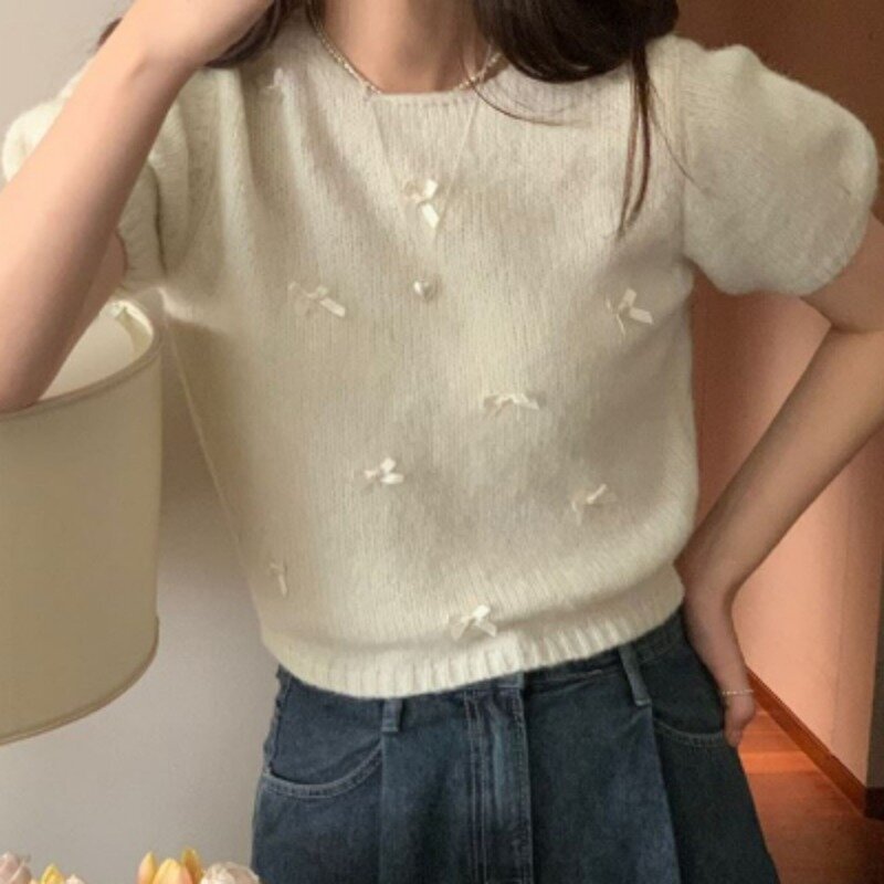 All'inizio della primavera nuova ragazza coreana delicato fiocco manica corta Pullover maglione dolce morbido glutinoso lavorato a maglia Top abbigliamento femminile