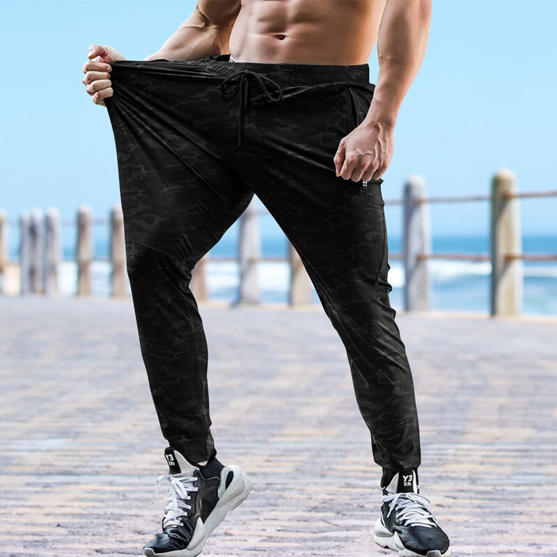 Rozciągliwe męskie spodnie dresowe siłownia szybkoschnące spodnie do biegania trening na świeżym powietrzu Jogging spodnie na co dzień męskie spodnie dresowe z kieszenią na zamek