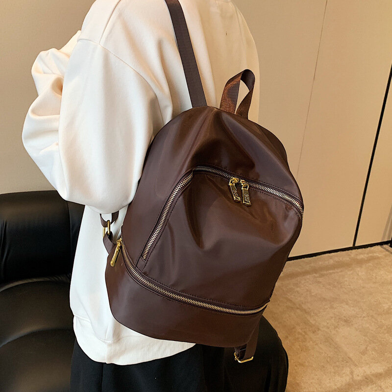 กระเป๋าเป้ผู้หญิงเรียบง่ายยอดนิยมโดยเฉพาะ2024ใหม่กระเป๋าเป้ความจุขนาดใหญ่กระเป๋านักเรียน