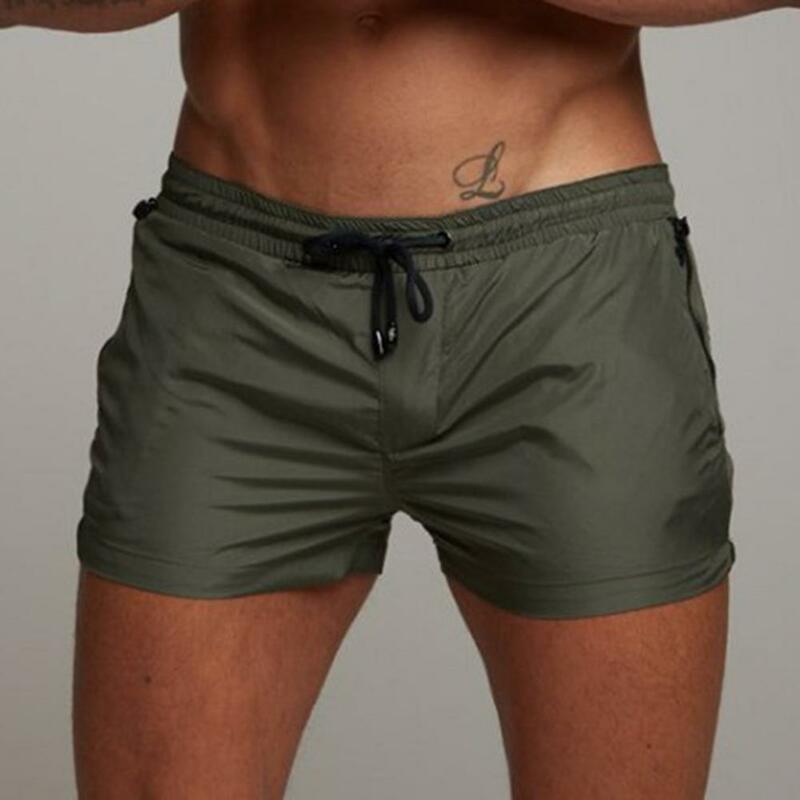 Cintura elástica de secagem rápida masculina Running Shorts com bolsos com zíper, streetwear design ergonômico para homens