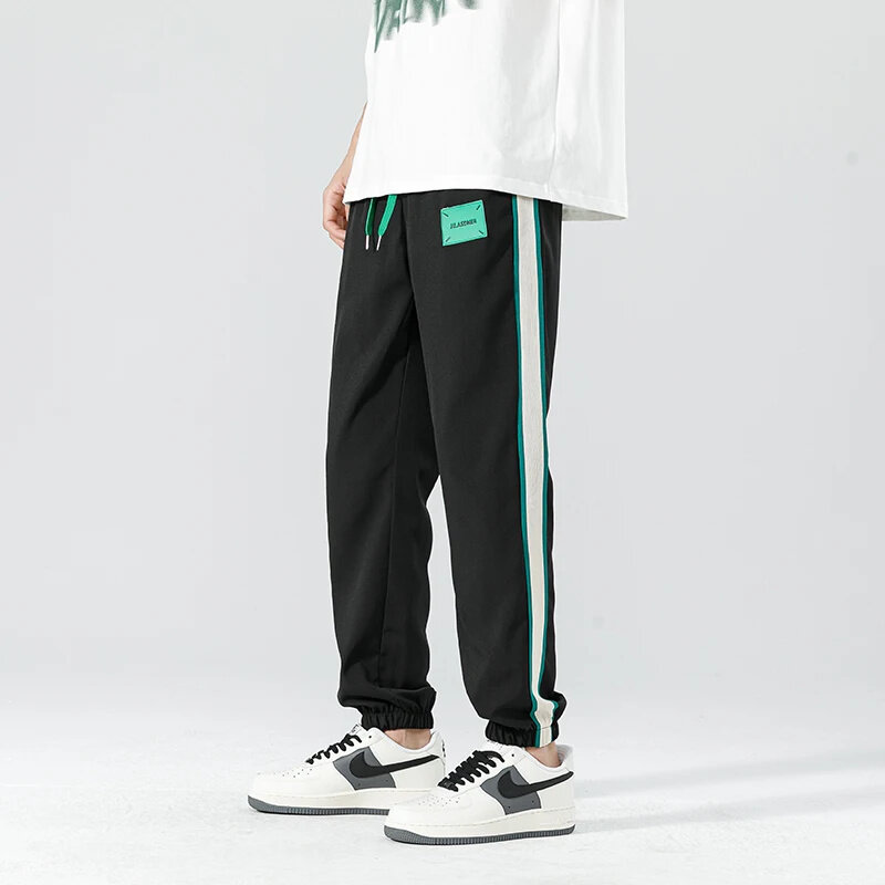 Spodnie z szerokimi nogawkami z boku w paski do 2024 koreańskiej wersji koreańskiej modne Hip-hop luźne, na co dzień, proste, sportowe bieganie na świeżym powietrzu