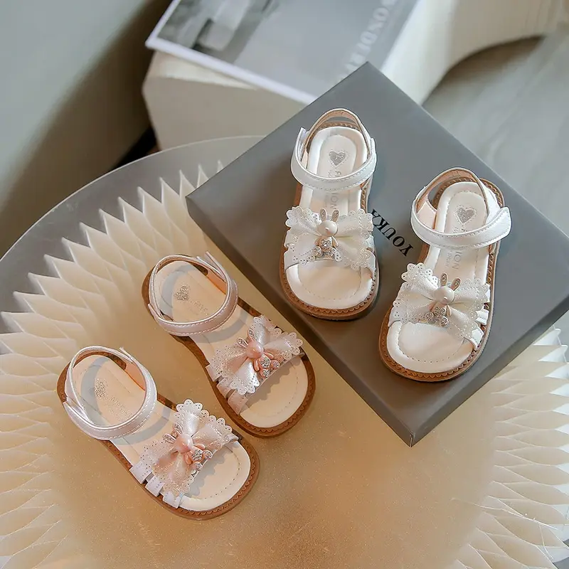 Sandalias planas antideslizantes para niños y niñas, zapatos con lazo y diseño de conejo suave, dedos abiertos, 2024