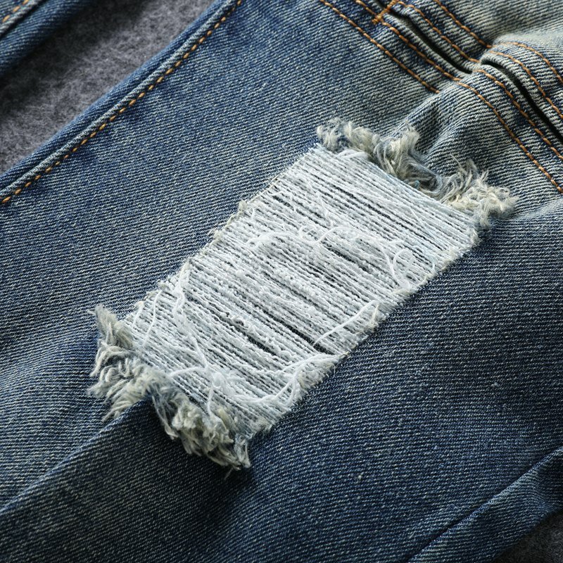 Jeans da moto pieghettati rotti per uomo con vestibilità slim e piedi piccoli pantaloni casual in denim elasticizzato di tendenza retrò e nostalgici
