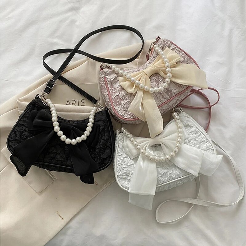Adjuestable damskie Retro luksusowe perłowe torebka z łańcuszkiem damskie jednokolorowa kokarda torby Crossbody moda płótno 2024 modna torba na ramię