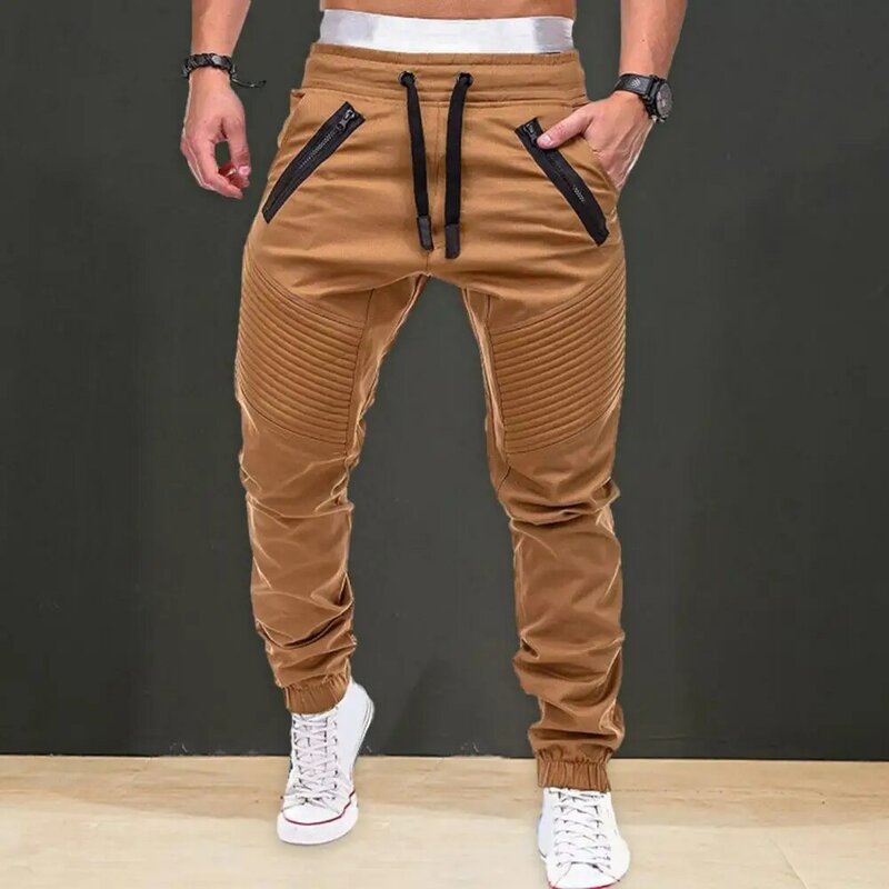 Celana panjang pinggang elastis untuk pria, celana panjang kasual warna polos desain tali serut dengan saku untuk musim semi