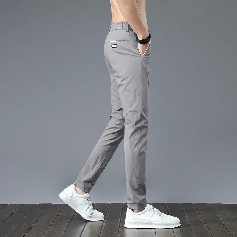 Koreańskie Casual jednolity, modny średnio wysoka talia męskie spodnie letnie biuro biznesowe prostota kieszenie łączone spodnie odzież męska