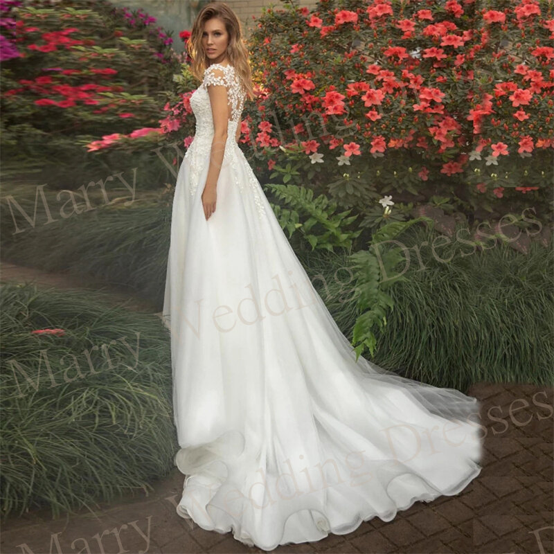 Pełne wdzięku suknie ślubne z krótkim rękawem, nowe koronkowe aplikacje z iluzją sukni ślubnej hojne klasyczne tiulowe Vestidos Para Mujer