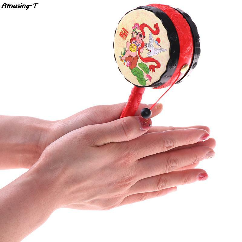 1Pc dziecko dziecko chińskie tradycyjne grzechotka bęben wirowania fajne zabawki dzwonek ręczny zabawki muzyczne dziecko Instrument muzyczny zabawka edukacyjna
