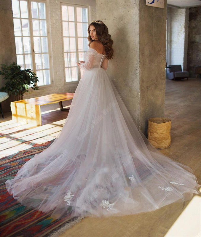 Eleganckie długie rękawy suknie ślubne jasne tiulowe suknie ślubne bez pleców nowe linie do mopowania długości damskie długie Vestidos De Novia