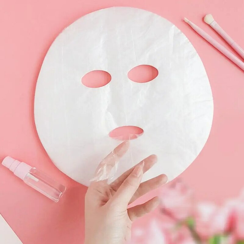 Pellicola di plastica usa e getta per il viso maschera detergente per il viso maschera adesivi per il collo carta trasparente maschere in PE avvolgere la bellezza del viso strumento sano