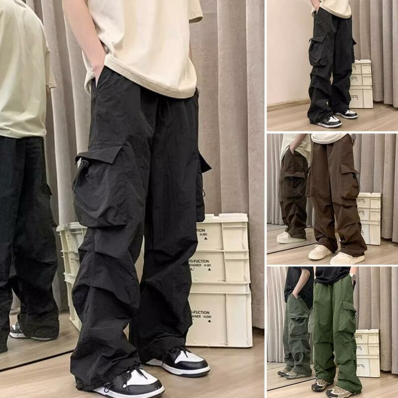 Celana panjang kerja pria, celana kargo trendi saku diperkuat dengan banyak saku longgar pinggang elastis untuk pinggul
