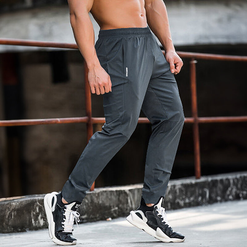 Celana kebugaran pria, pakaian ukuran besar untuk lelaki Jogging luar ruangan musim semi dan panas