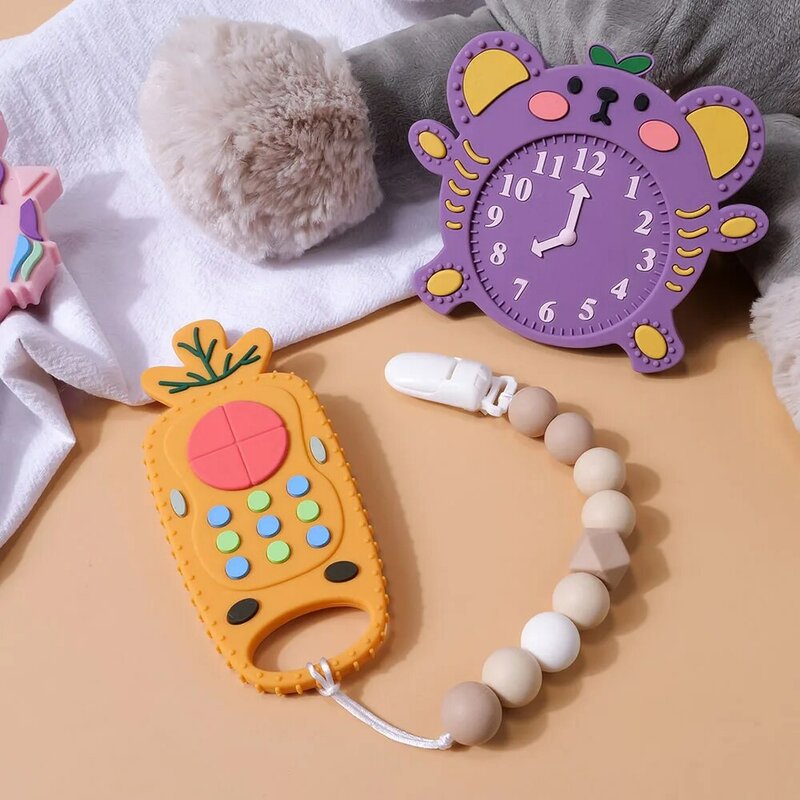 Tyry.hu-赤ちゃんのためのシリコン歯がためリング,リモコン形状,げっ歯類ガムの痛みを和らげる,子供のための感覚玩具