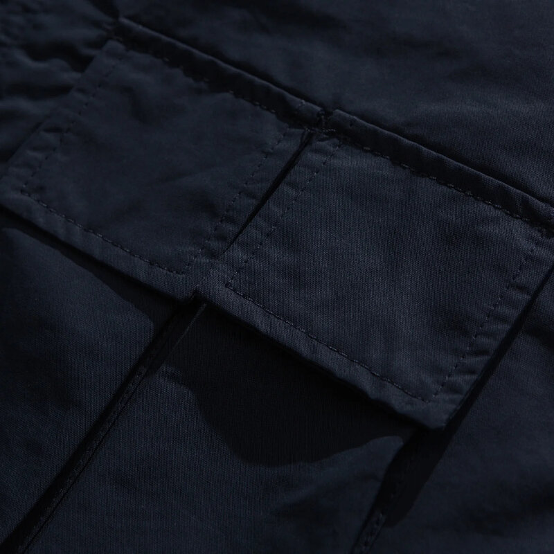 Giacca a vento da uomo primavera all'aperto giapponese Multi tasca colletto alla coreana semplicità Trench solido sciolto giacca con utensili di media lunghezza